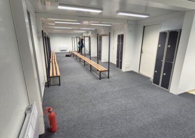 With the client seeking a single-order solution, our team also procured and installed a comprehensive range of supporting infrastructure and internal fit-out items, including: Hard PVC walling for screening and branding Heras fencing Benches for the changing rooms, including integrated shoe racks Treatment tables Internal and external floor coverings Lockers Miscellaneous furniture and ancillary equipment Alongside managing the installation of all modular buildings and equipment, our engineers carried out all plumbing requirements, including a fresh water supply and waste provision for the duration of the hire. A standby engineer also remained on site throughout the event to provide technical support and ensure everything went smoothly. The project wasn’t without its challenges given the location where the units needed to be sited. Within the outdoor broadcast area within the stadium, there were some logistical hurdles to overcome with bollards and low level lighting fixtures factored in. Delivered within a tight installation window, the project enabled Brentford FC to successfully host an international competition environment with the addition of welfare and performance facilities for the footballers, support teams and officials.